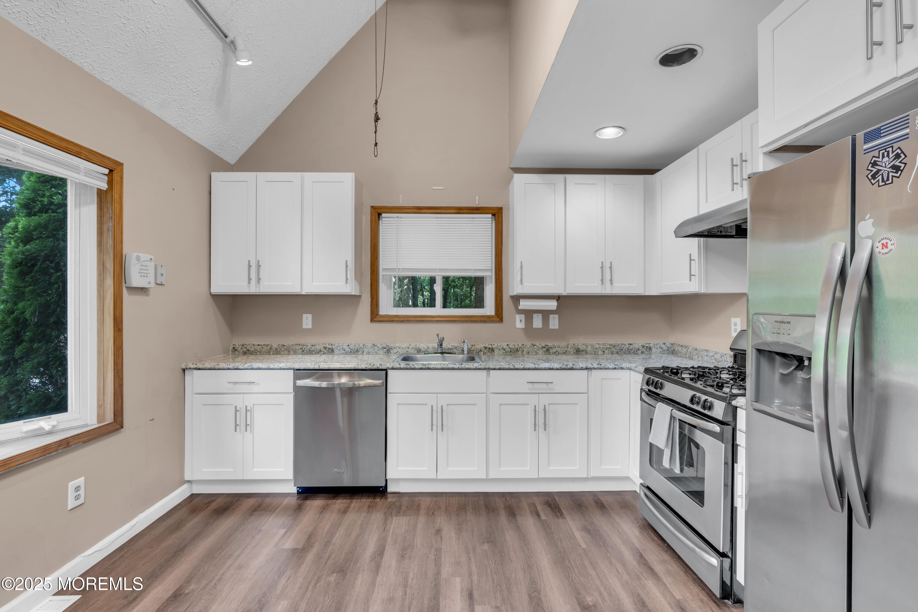 1623 Church Road Toms River, NJ 08755 - Photo 12 of 37 a kitchen with a refrigerator a sink and a stove top oven