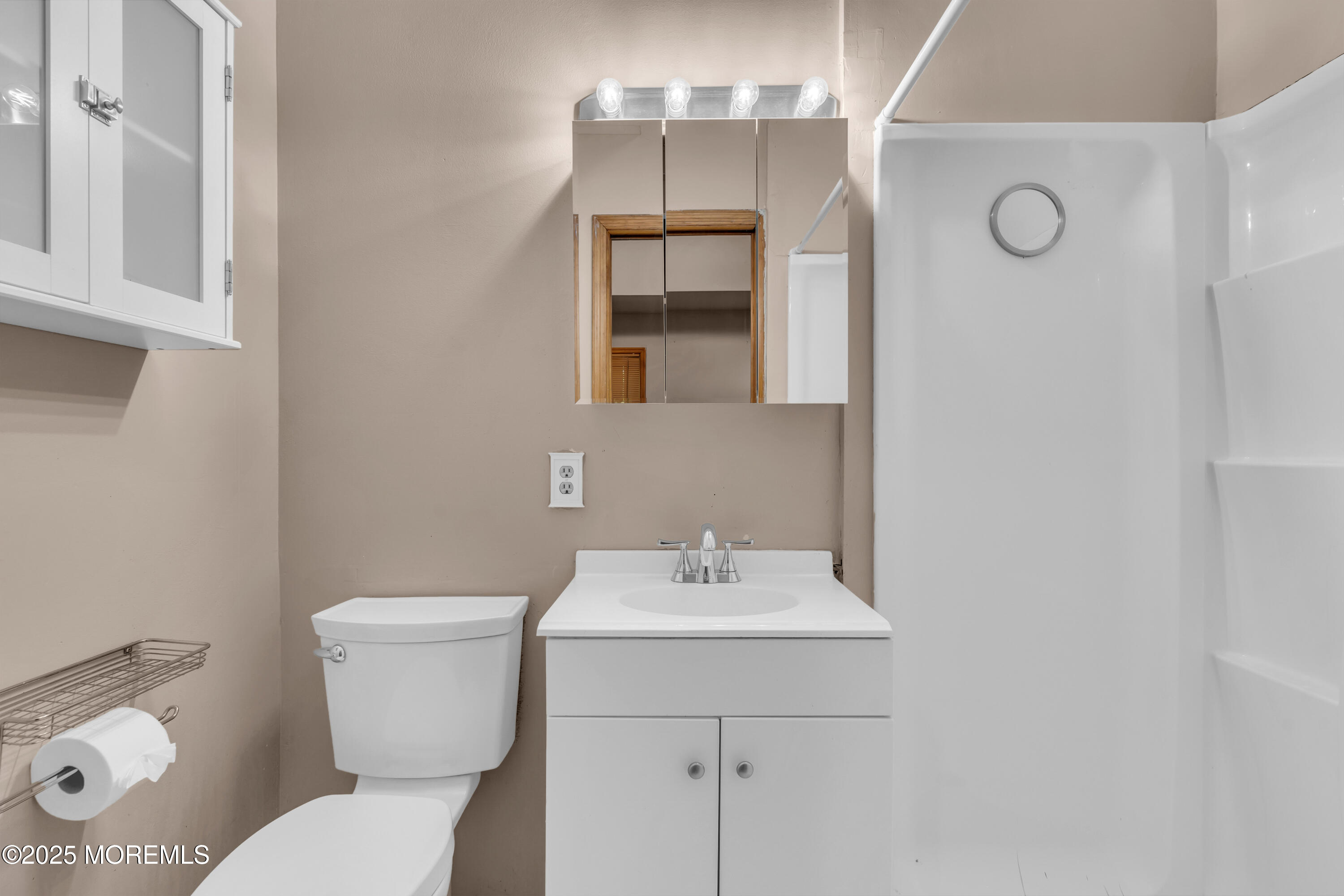 1623 Church Road Toms River, NJ 08755 - Photo 16 of 37 a bathroom with a toilet sink and mirror