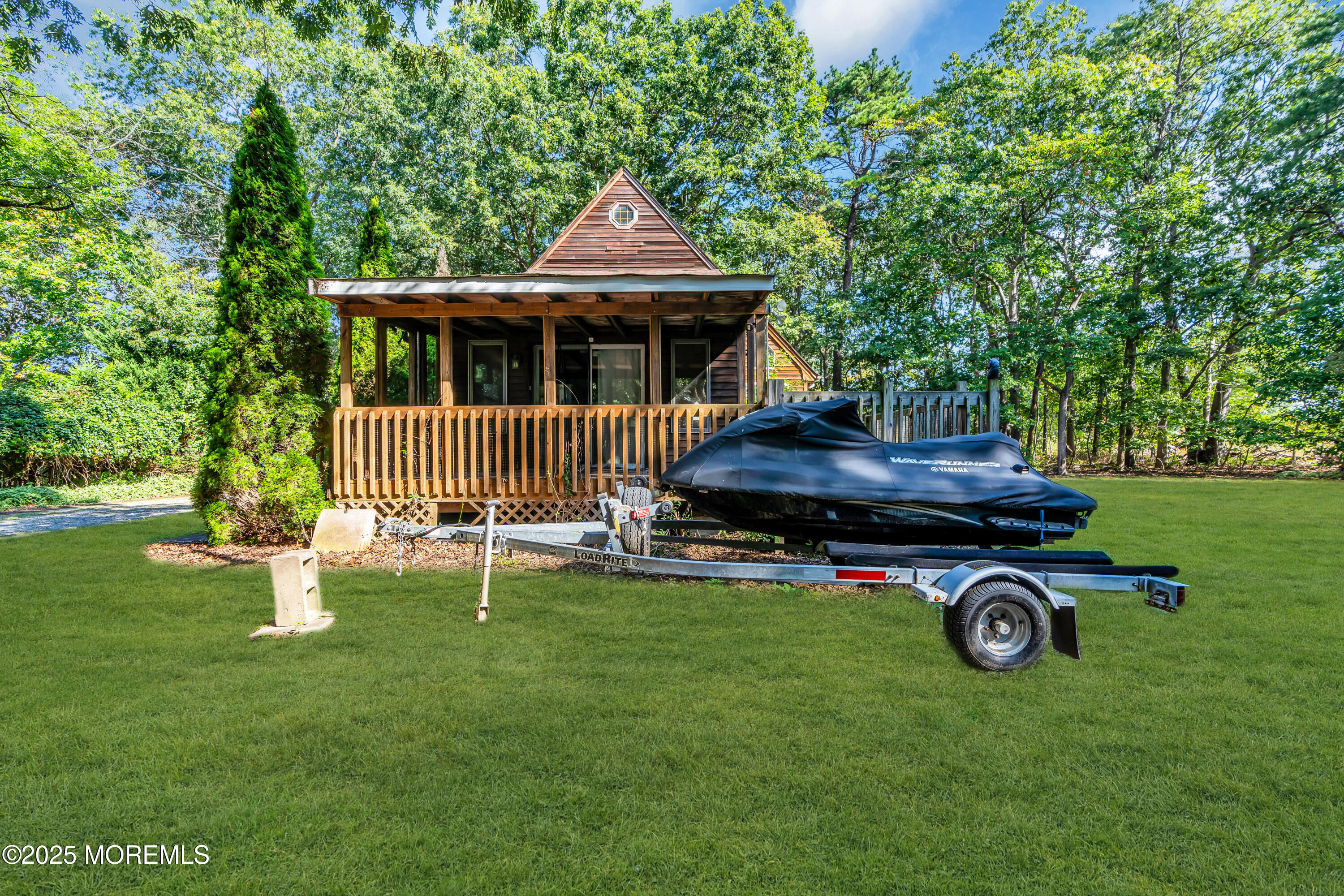 1623 Church Road Toms River, NJ 08755 - Photo 23 of 37 a front view of a house with garden and trees