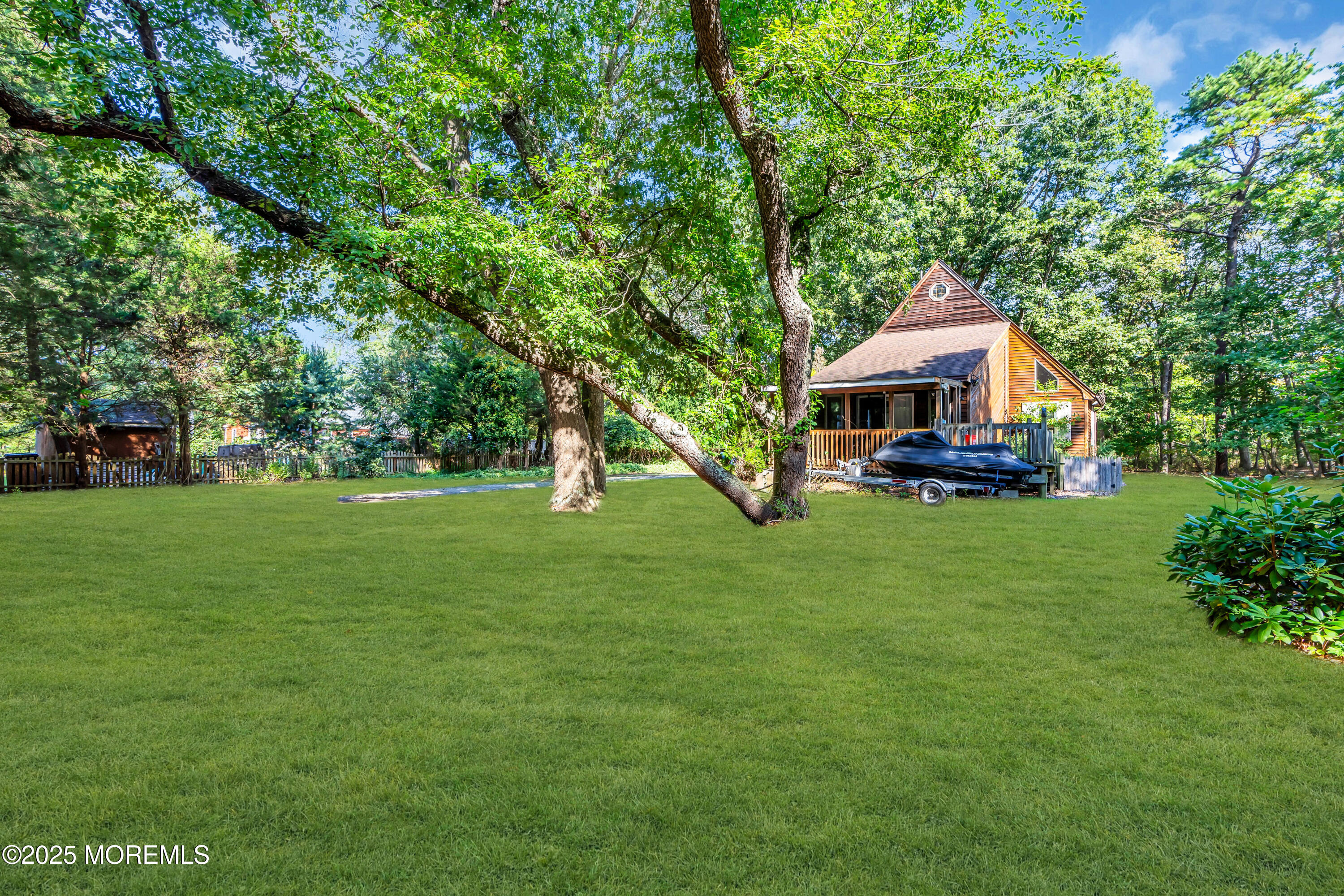 1623 Church Road Toms River, NJ 08755 - Photo 24 of 37 a front view of a house with a yard table and trees