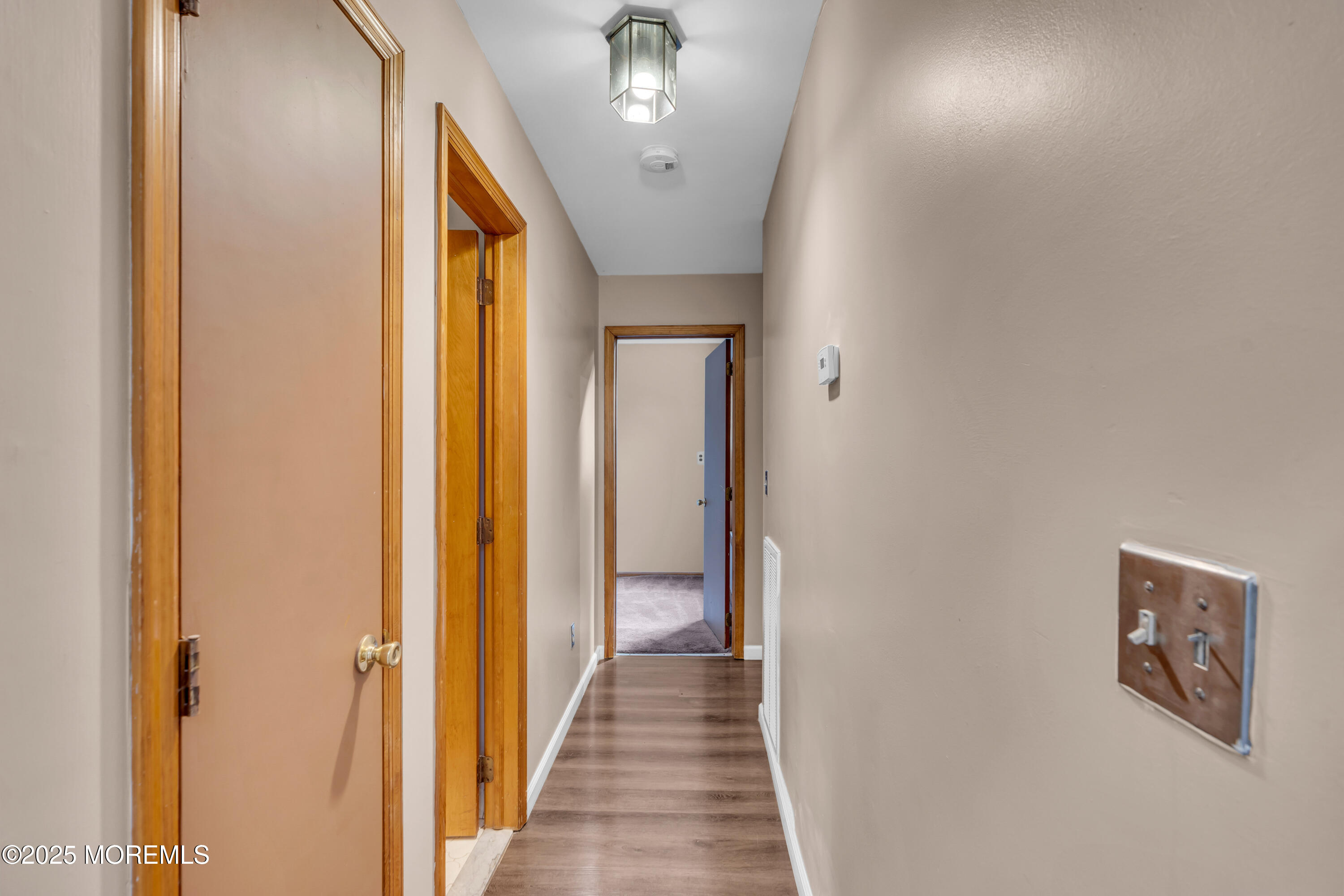 1623 Church Road Toms River, NJ 08755 - Photo 31 of 37 a view of a hallway with wooden floor and staircase