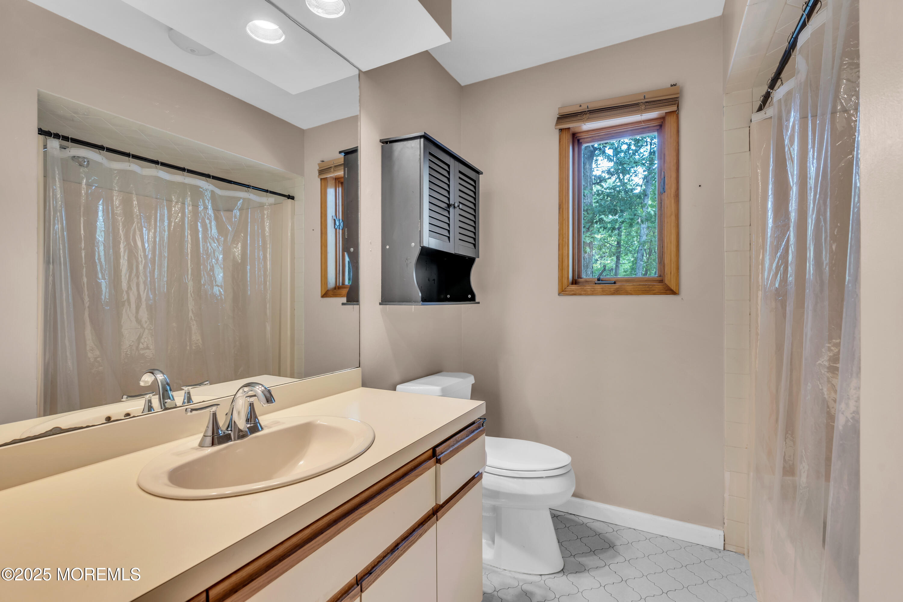 1623 Church Road Toms River, NJ 08755 - Photo 34 of 37 a bathroom with a sink a toilet and mirror