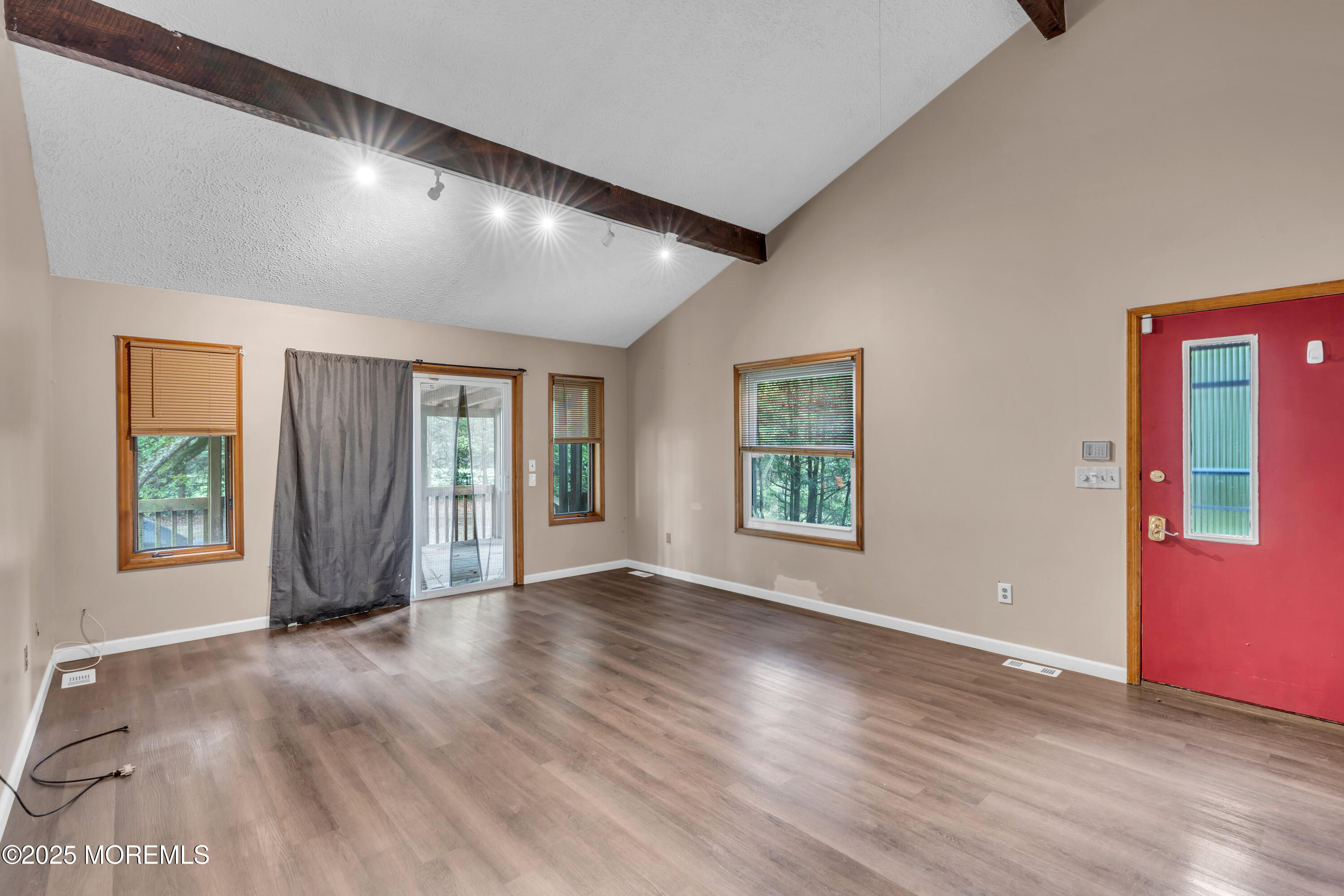 1623 Church Road Toms River, NJ 08755 - Photo 4 of 37 a view of an empty room with wooden floor and a window