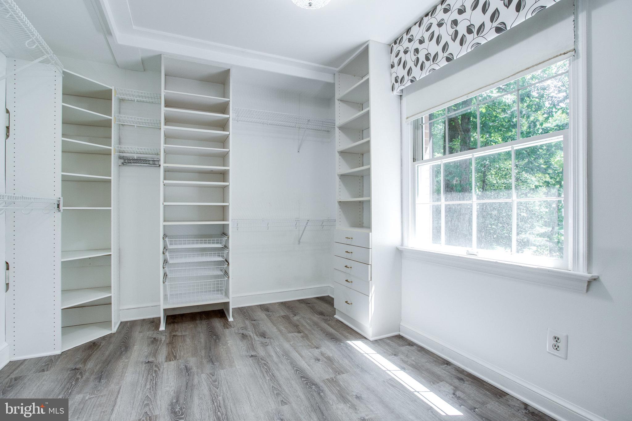 8500 Brook Road McLean, VA 22102 - Photo 27 of 52 wooden floor in an empty room with a window