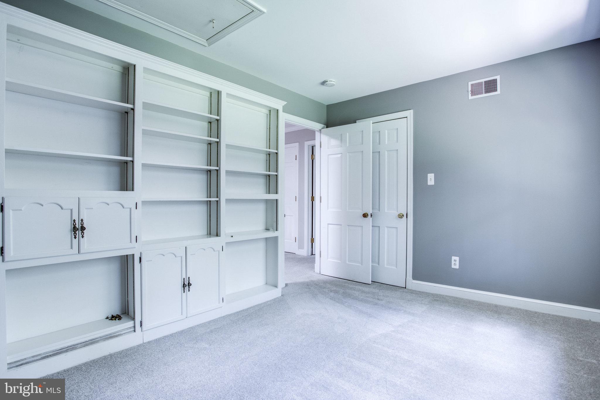 8500 Brook Road McLean, VA 22102 - Photo 35 of 52 a view of an empty room with cabinet and entryway