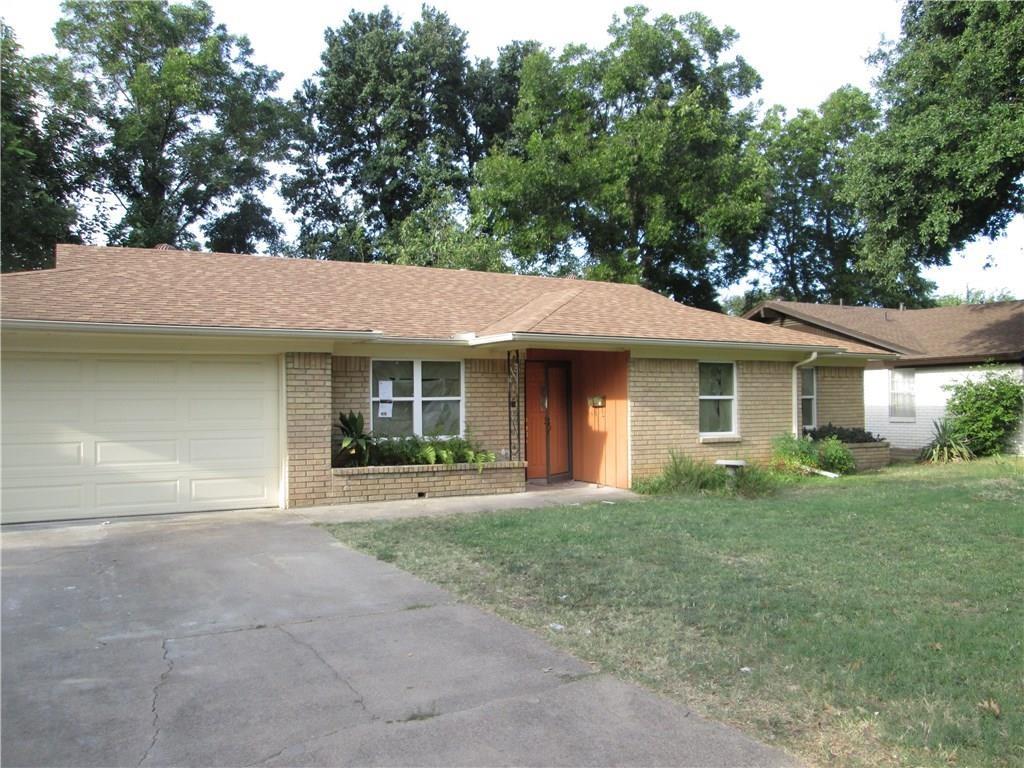 518 Burnwood Drive Irving, TX 75062 - Photo 15 of 18 a front view of a house with a garden and yard