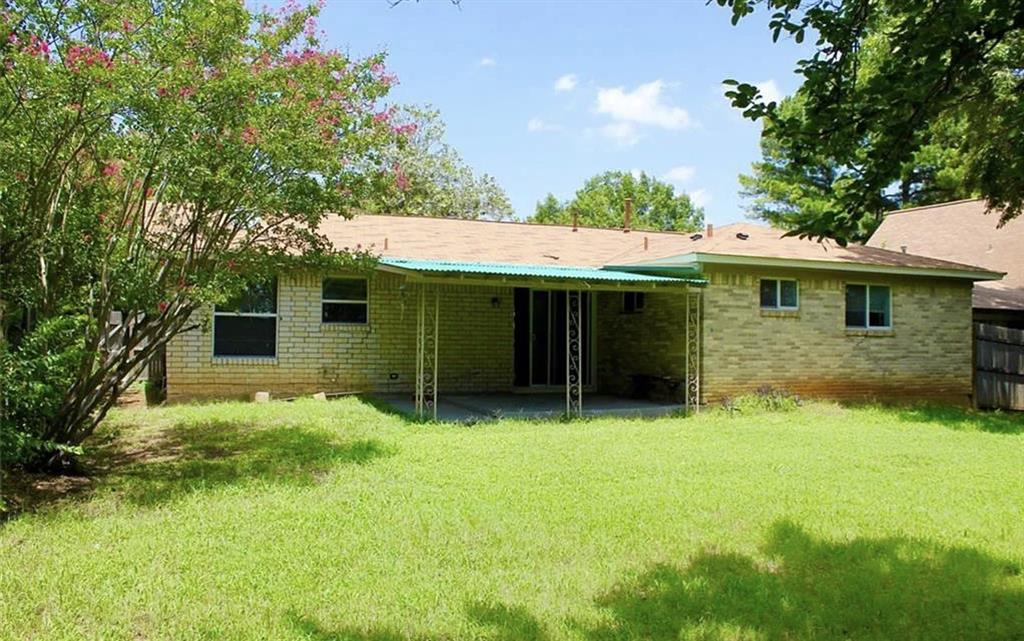 518 Burnwood Drive Irving, TX 75062 - Photo 16 of 18 a view of a house with a yard