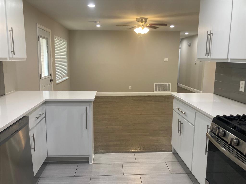 518 Burnwood Drive Irving, TX 75062 - Photo 4 of 18 a kitchen with a cabinets and a stove