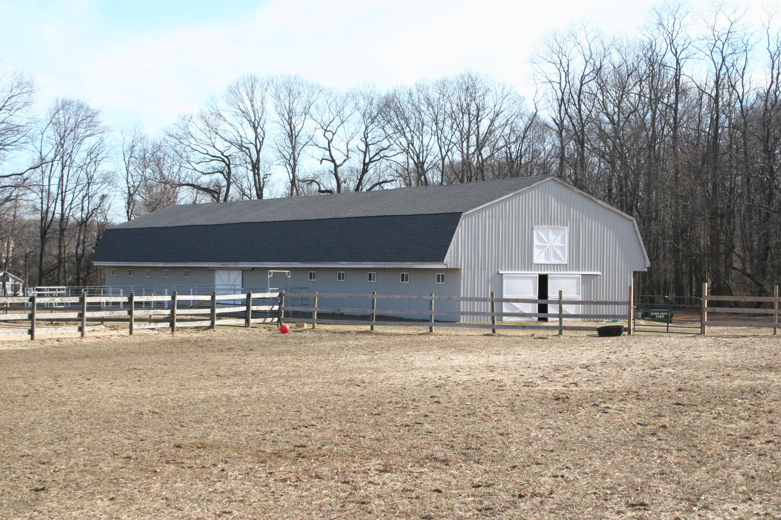 193 Stone Hill Road Colts Neck, NJ 07722 - Photo 4 of 6 a view of a house with a patio and a snow