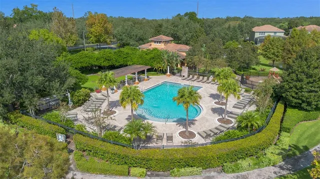 a view of a swimming pool with a yard