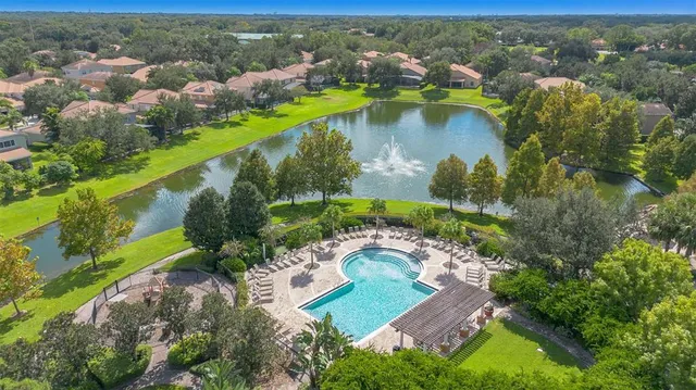 an aerial view of a house with a lake view