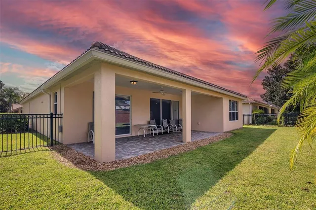 a front view of a house with a yard and porch