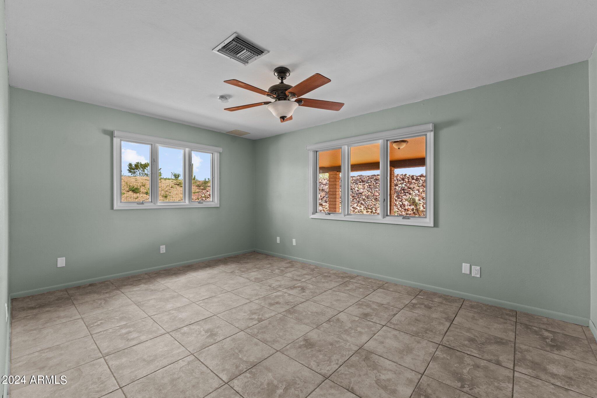1605 North Little Stonehedge Ranch Road Wickenburg, AZ 85390 - Photo 22 of 54 a view of an empty room with a window