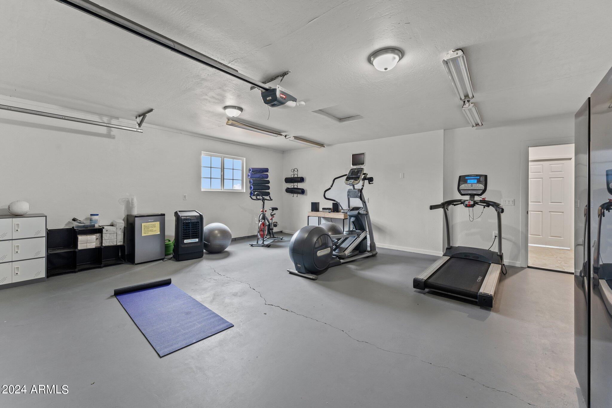 1605 North Little Stonehedge Ranch Road Wickenburg, AZ 85390 - Photo 30 of 54 a view of a room with gym equipment