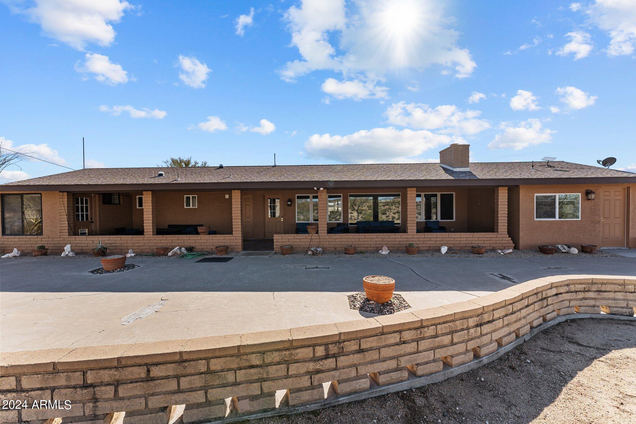 1605 North Little Stonehedge Ranch Road Wickenburg, AZ 85390 - Photo 36 of 54 a view of a house with backyard and sitting area