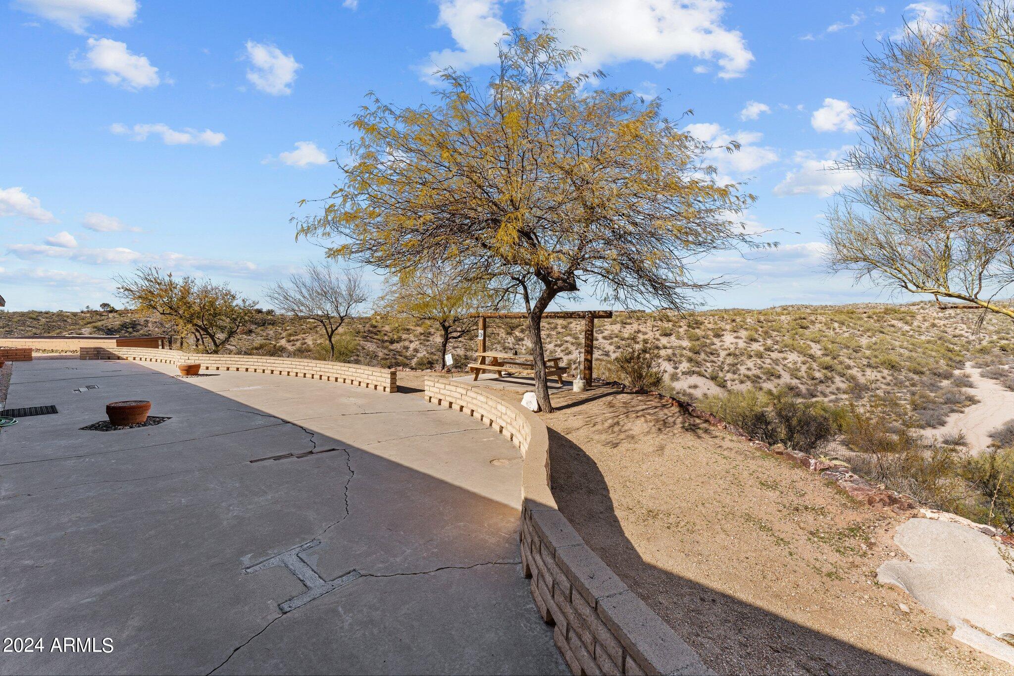 1605 North Little Stonehedge Ranch Road Wickenburg, AZ 85390 - Photo 42 of 54 a view of swimming pool with a terrace