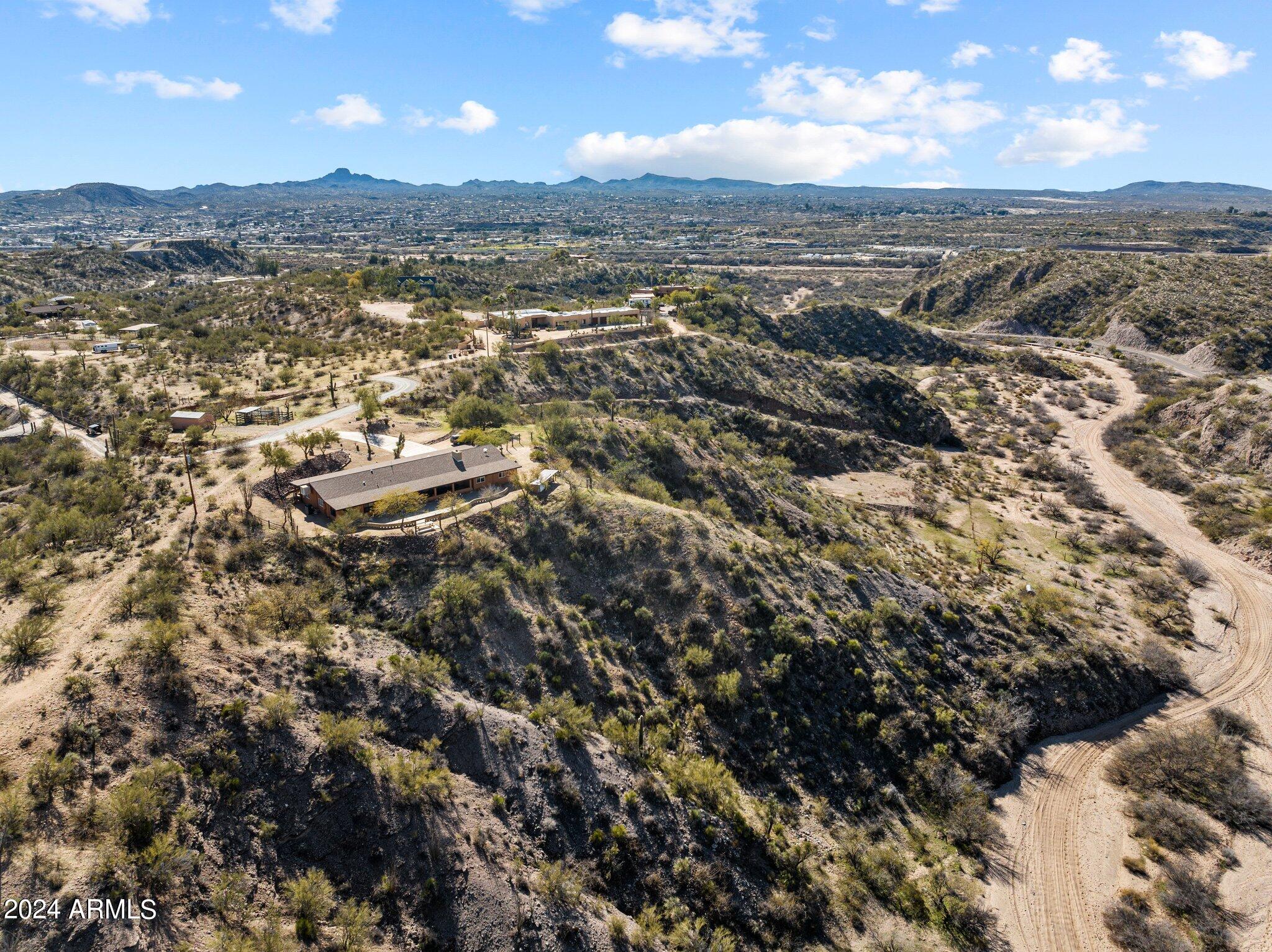 1605 North Little Stonehedge Ranch Road Wickenburg, AZ 85390 - Photo 46 of 54 an aerial view of residential building with parking space
