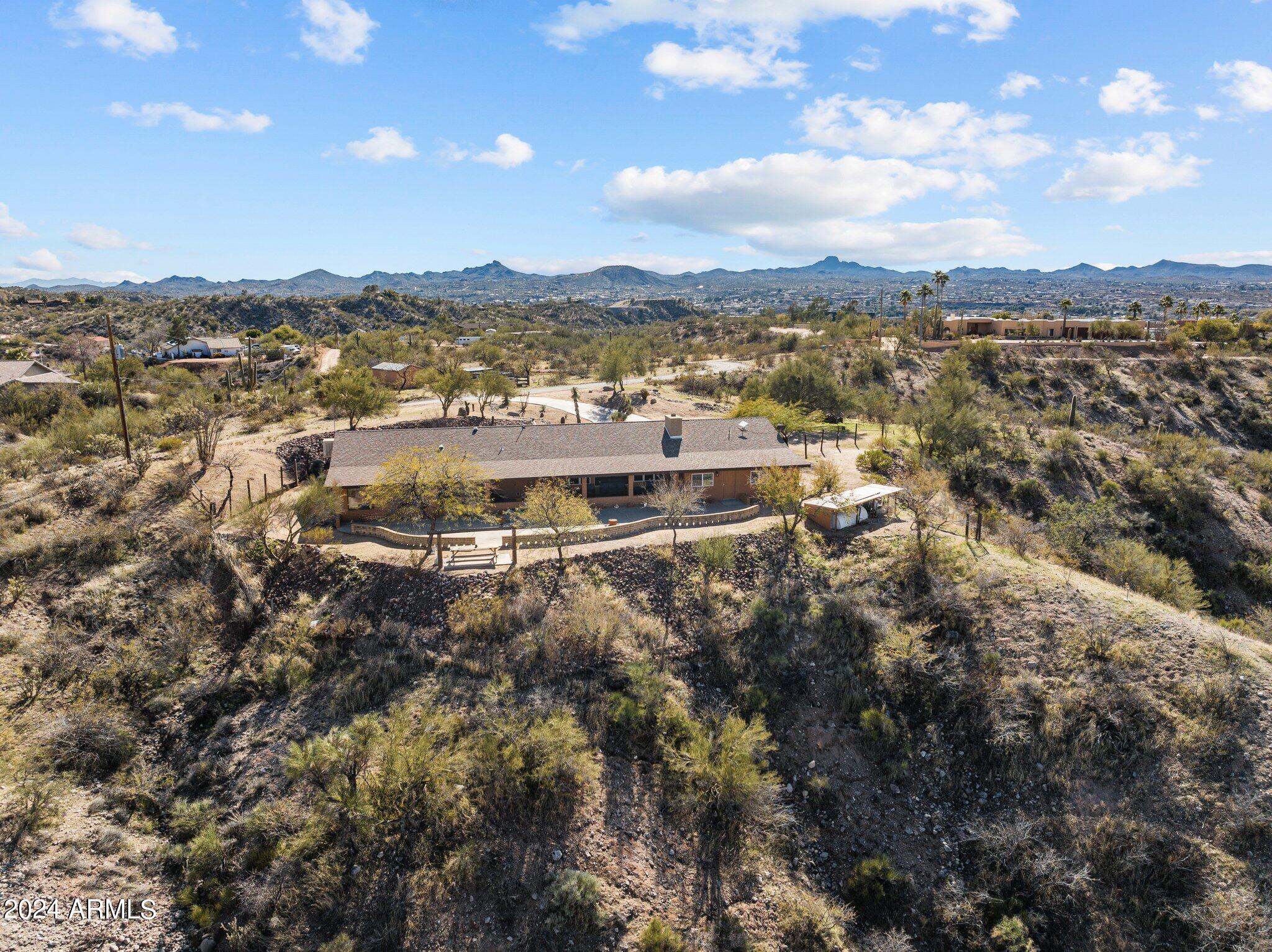 1605 North Little Stonehedge Ranch Road Wickenburg, AZ 85390 - Photo 47 of 54 a view of a city with mountains in the background