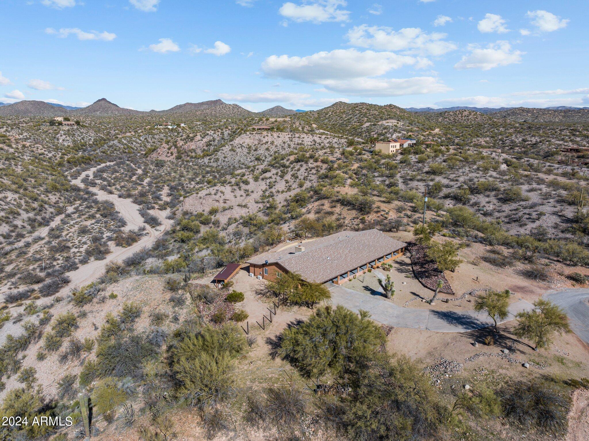 1605 North Little Stonehedge Ranch Road Wickenburg, AZ 85390 - Photo 49 of 54 a view of a house with a mountain