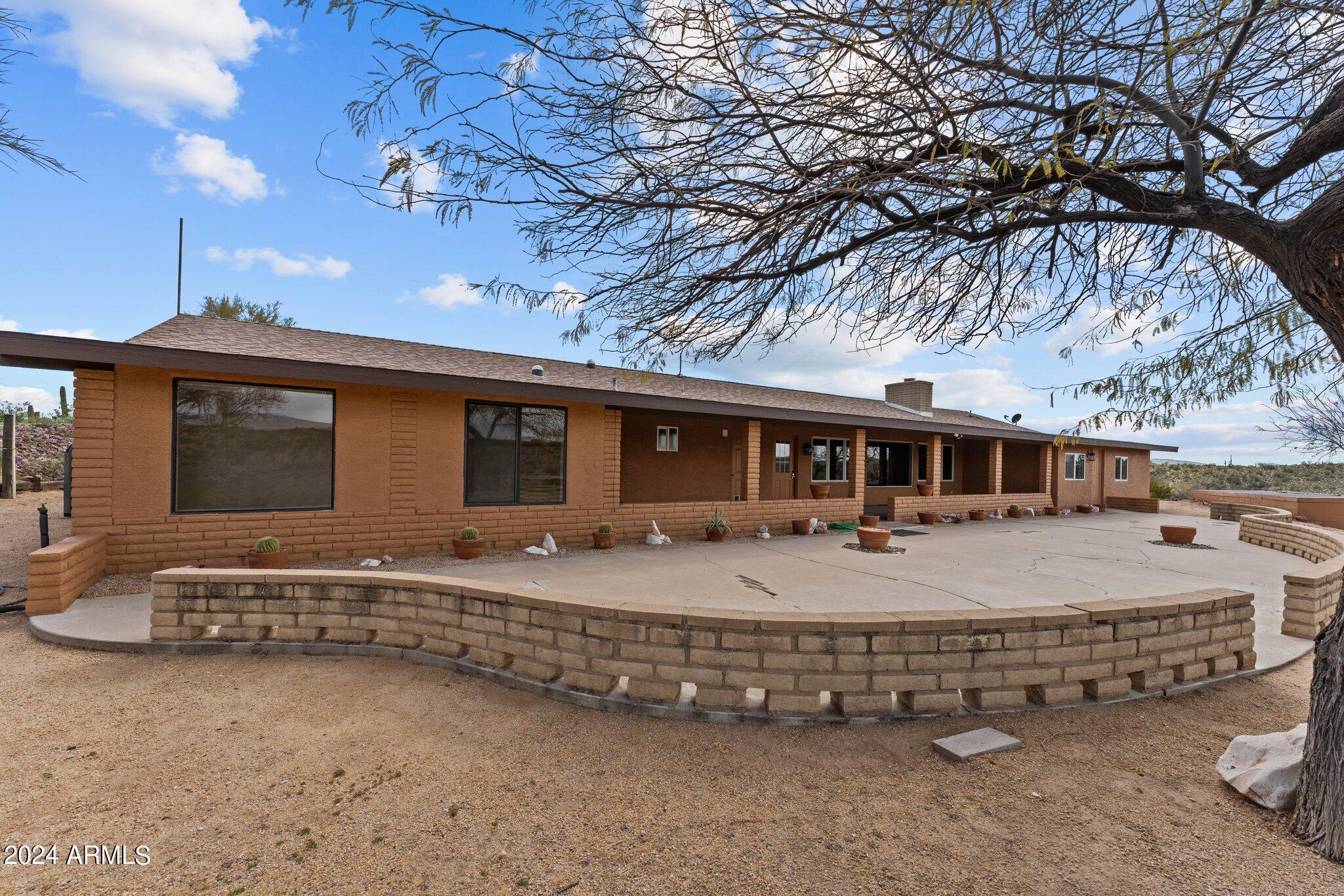 1605 North Little Stonehedge Ranch Road Wickenburg, AZ 85390 - Photo 52 of 54 a front view of a house with a yard