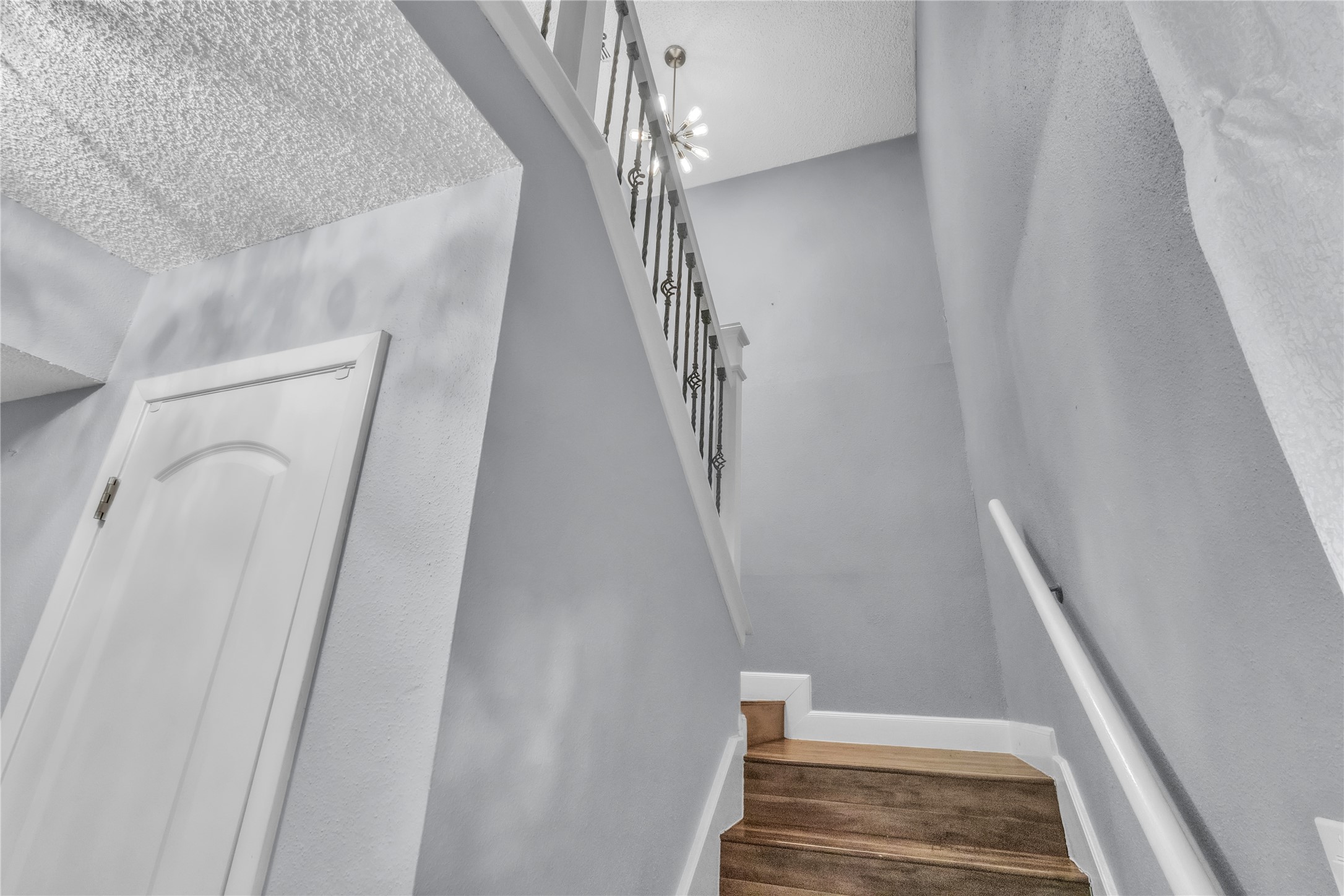 7044 South Dairy Ashford Road Houston, TX 77072 - Photo 15 of 30 a view of staircase with white walls and railing