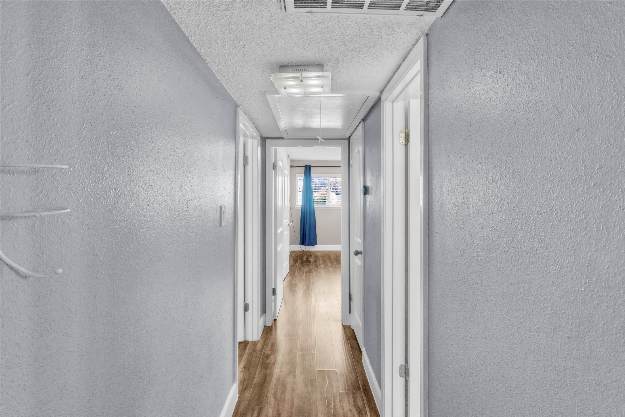 7044 South Dairy Ashford Road Houston, TX 77072 - Photo 17 of 30 a view of a hallway with wooden floor and staircase