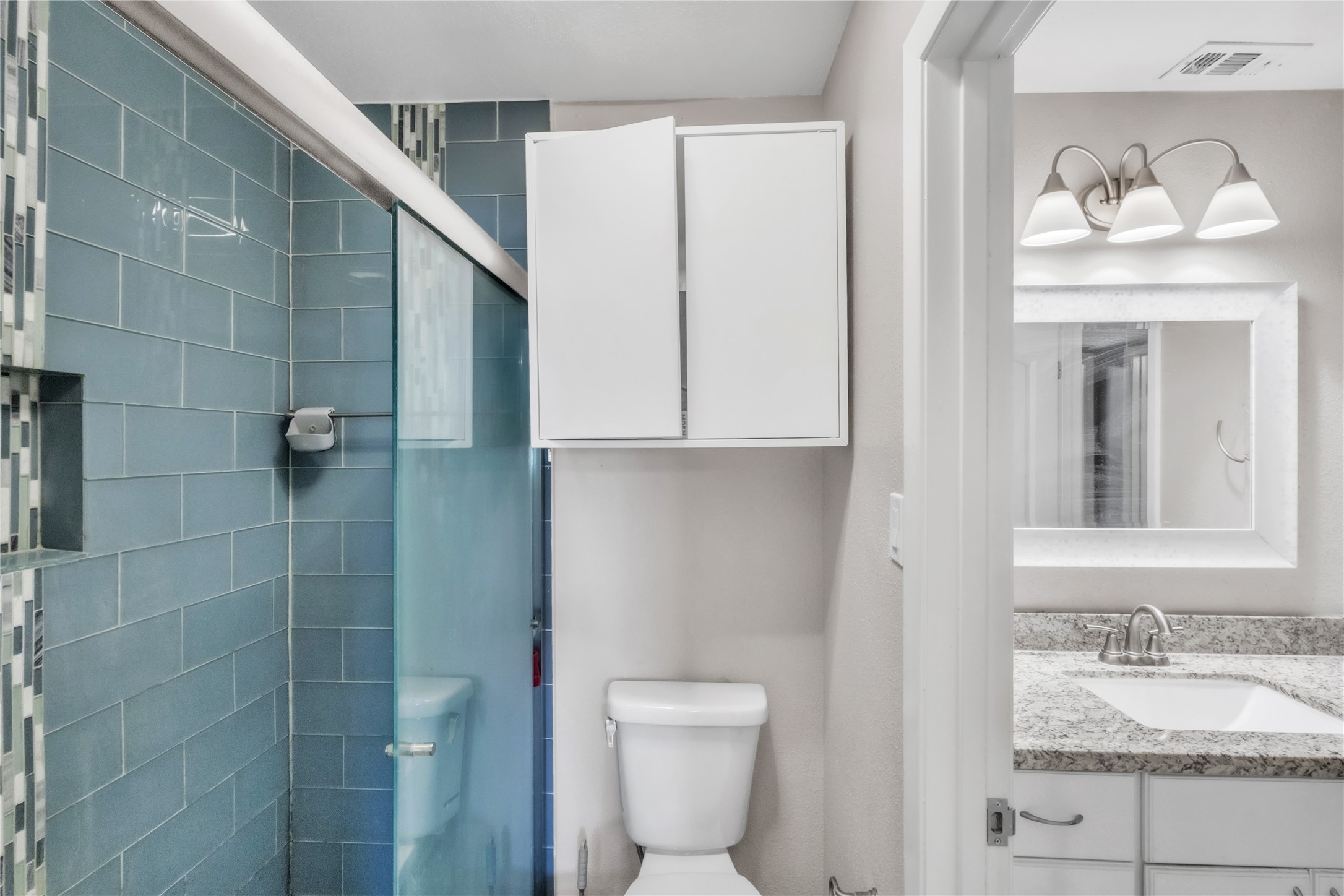7044 South Dairy Ashford Road Houston, TX 77072 - Photo 19 of 30 a bathroom with a granite countertop sink mirror and toilet