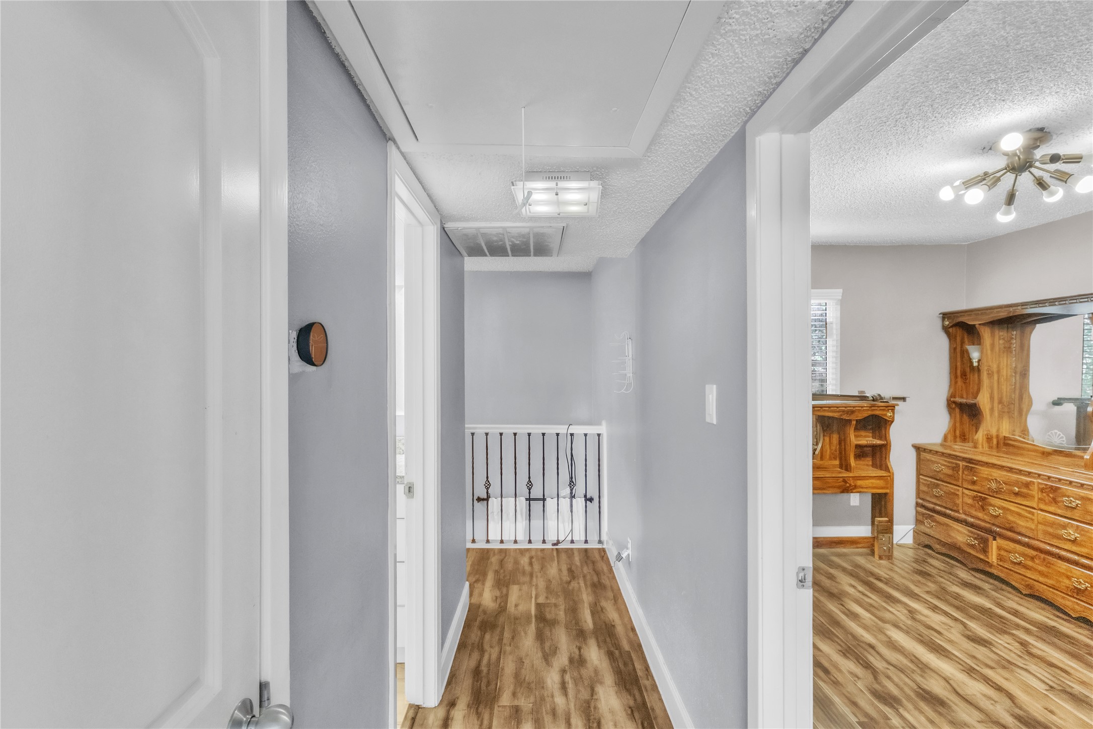 7044 South Dairy Ashford Road Houston, TX 77072 - Photo 24 of 30 a view of a hallway with wooden floor and staircase