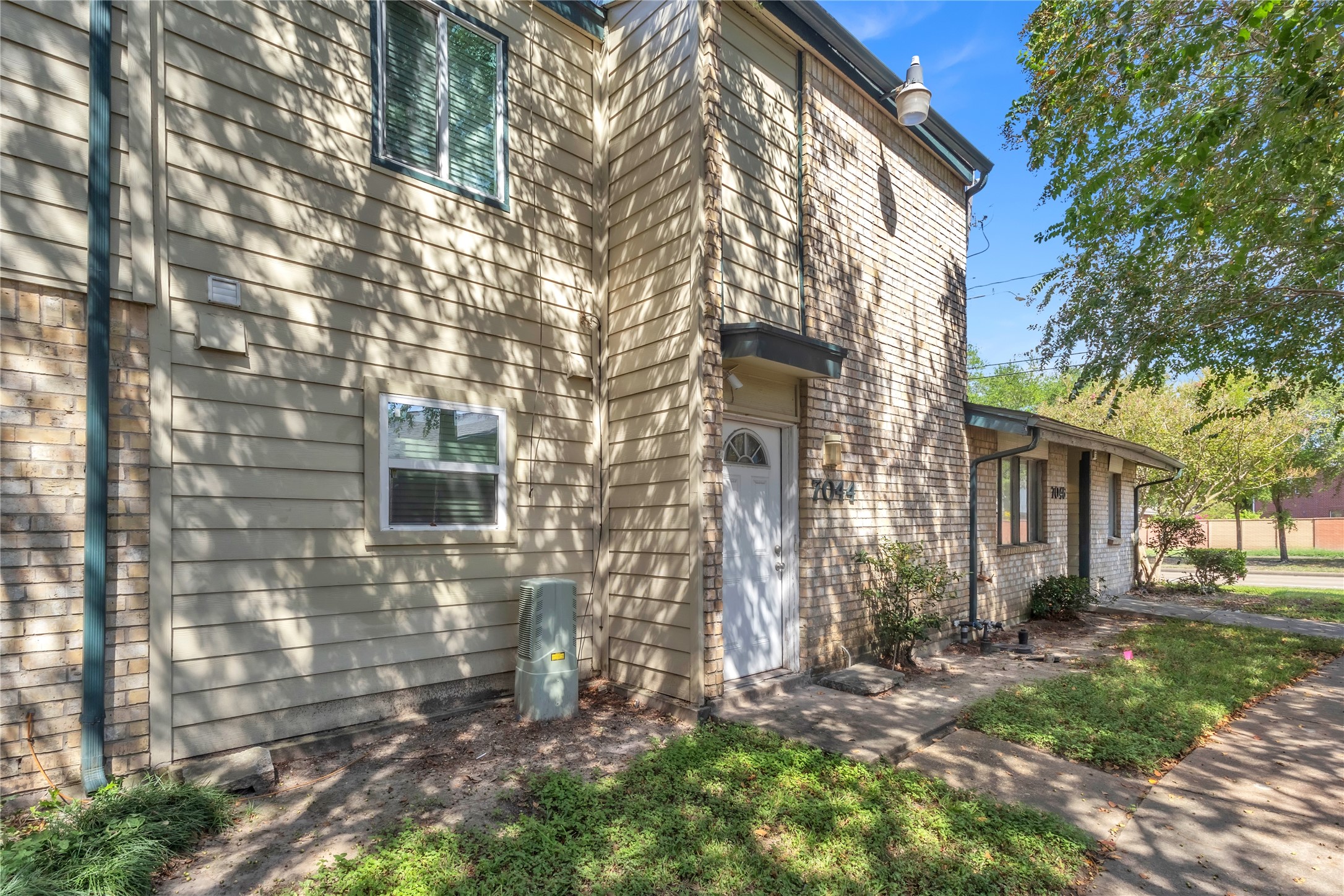 7044 South Dairy Ashford Road Houston, TX 77072 - Photo 4 of 30 a view of a house with a yard