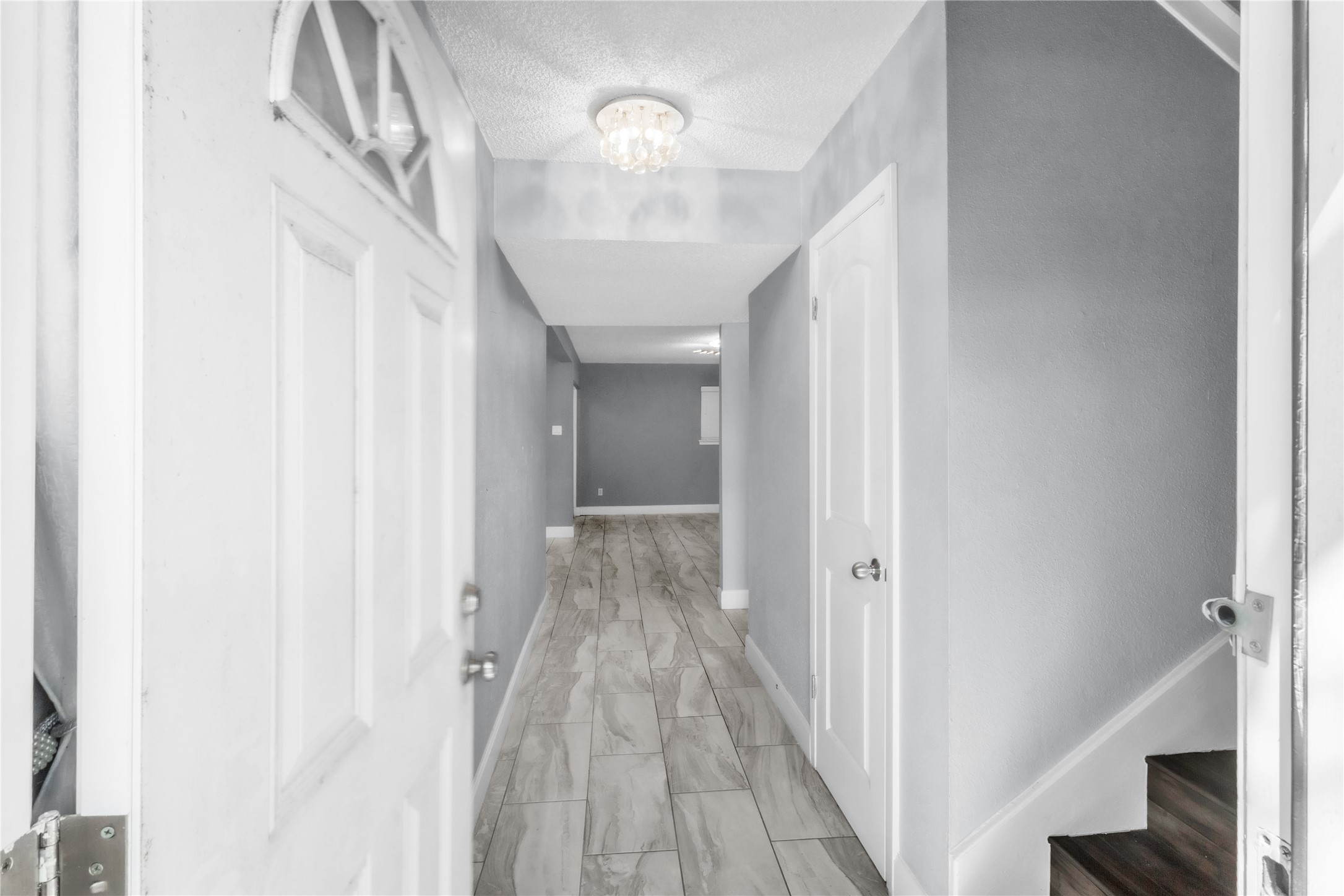 7044 South Dairy Ashford Road Houston, TX 77072 - Photo 6 of 30 a view of a hallway with wooden floor and staircase