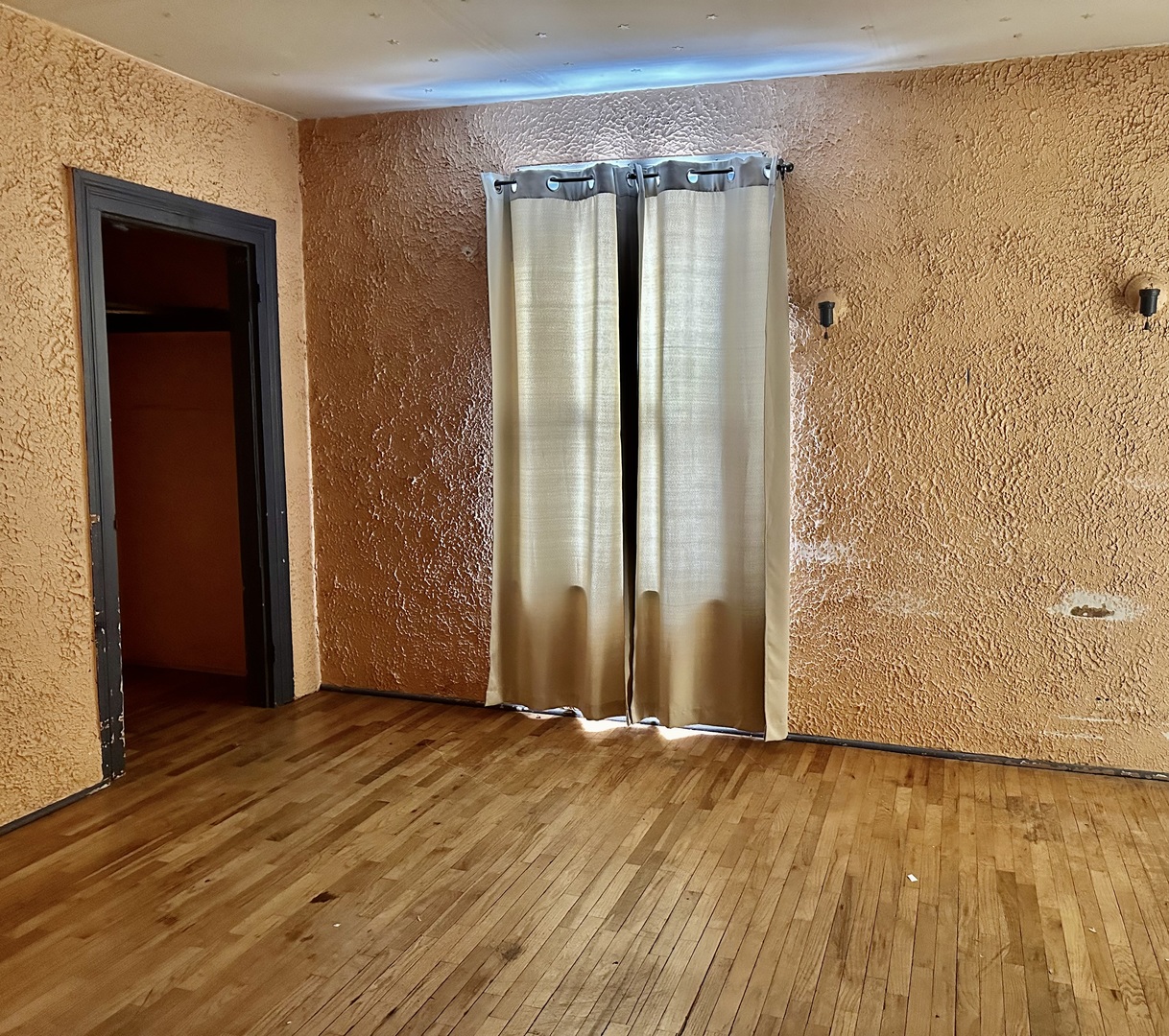 910 North Madison Street Bloomington, IL 61701 - Photo 11 of 11 an empty room with wooden floor and a window