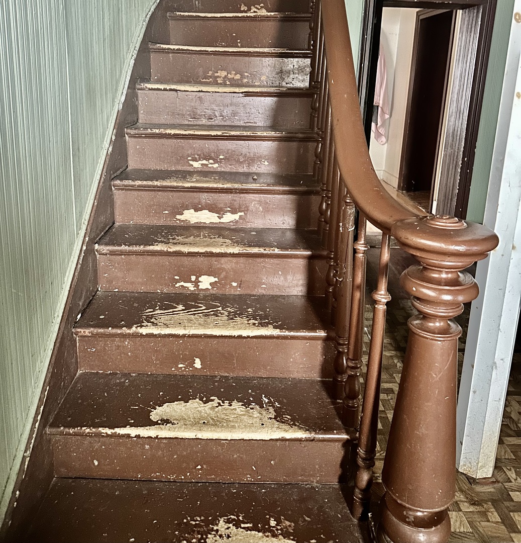 910 North Madison Street Bloomington, IL 61701 - Photo 8 of 11 a view of water heater room with wooden floor
