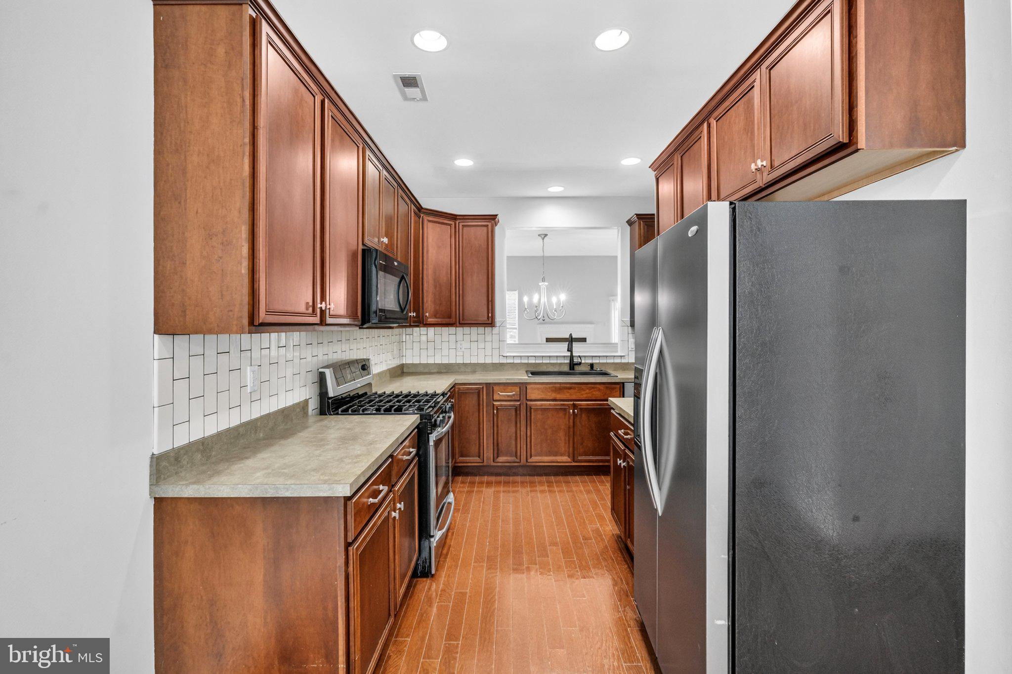 161 Stoyer Road Coatesville, PA 19320 - Photo 8 of 52 Modern kitchen with rich wood tones.