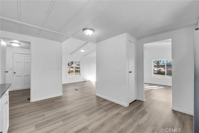 a kitchen with a white cabinets stove top oven and refrigerator