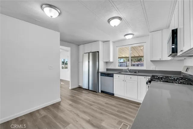 a view of cabinets and wooden floor