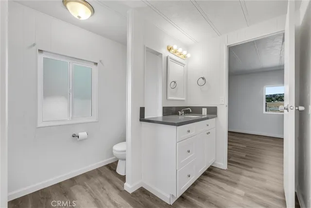 a bathroom with a double vanity sink and mirror