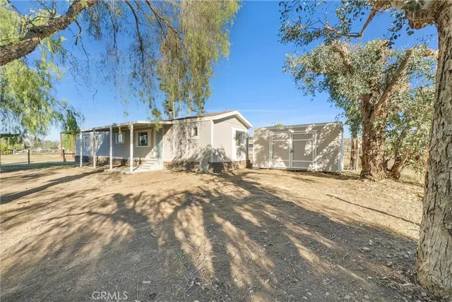 a pathway of a house with a garden