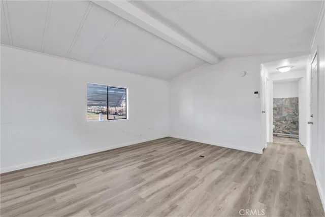 a bathroom with a sink a toilet and shower curtain