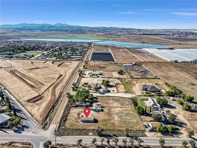 an aerial view of residential building and ocean view