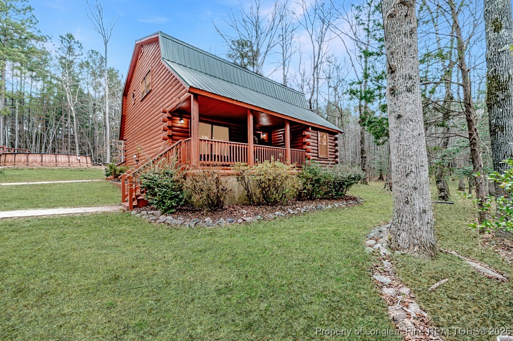 515 Tramway West Road Sanford, NC 27330 - Photo 1 of 38 a view of a house with a yard
