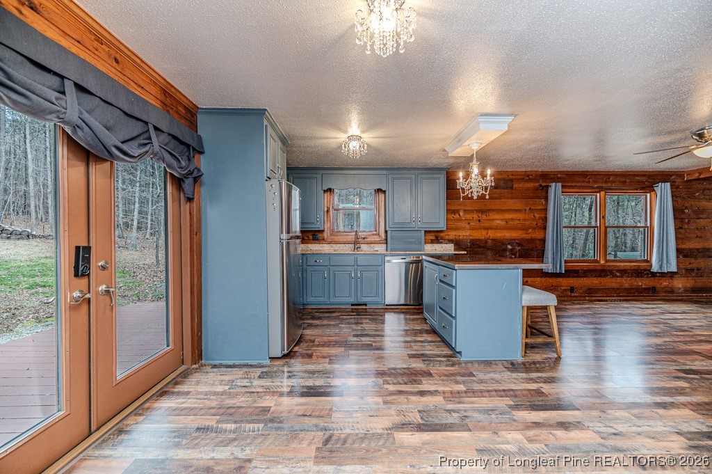 515 Tramway West Road Sanford, NC 27330 - Photo 12 of 38 a open kitchen with stainless steel appliances granite countertop a refrigerator and a stove top oven