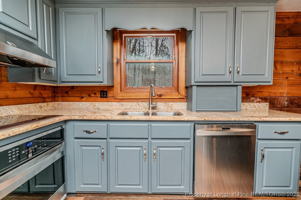 515 Tramway West Road Sanford, NC 27330 - Photo 14 of 38 a kitchen with granite countertop a sink and a stove