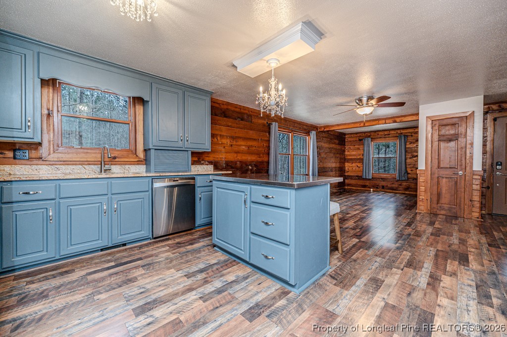 515 Tramway West Road Sanford, NC 27330 - Photo 15 of 38 a kitchen with stainless steel appliances granite countertop a sink and cabinets