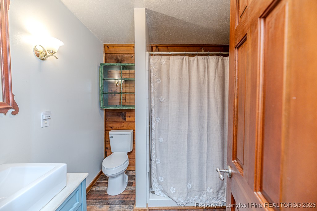 515 Tramway West Road Sanford, NC 27330 - Photo 18 of 38 a bathroom with a shower curtain and a window