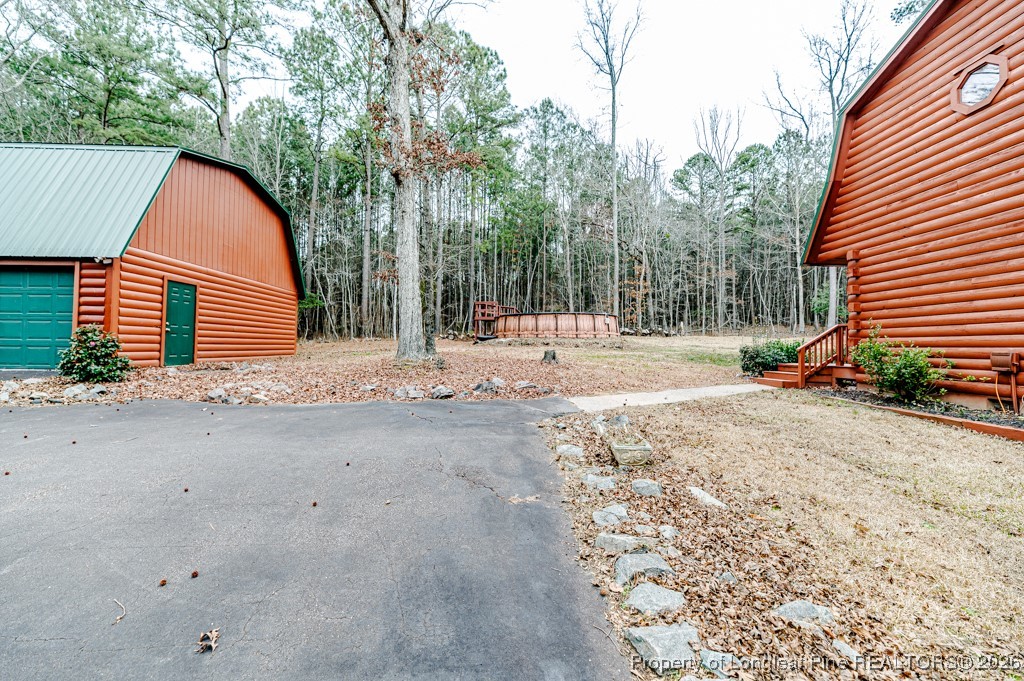 515 Tramway West Road Sanford, NC 27330 - Photo 5 of 38 a view of a backyard of the house