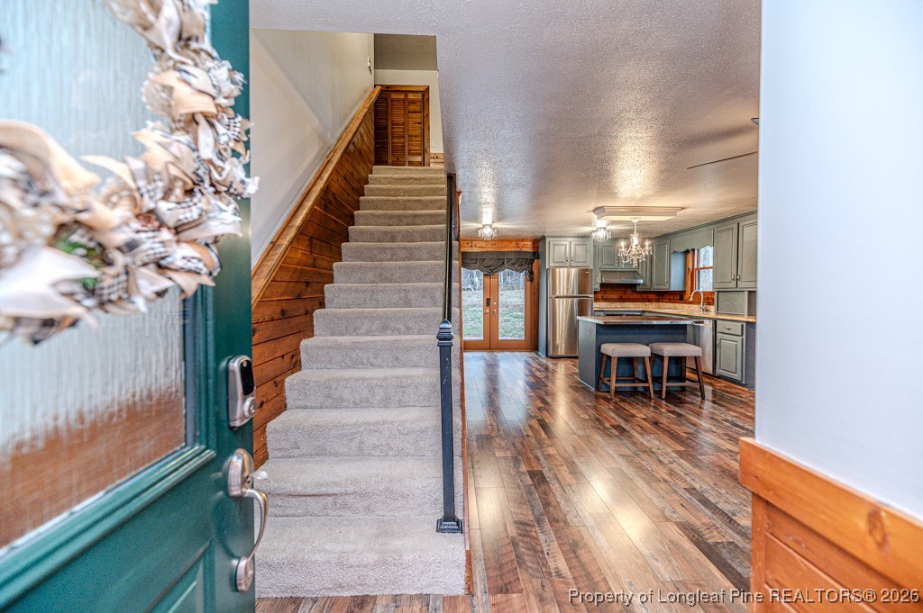 515 Tramway West Road Sanford, NC 27330 - Photo 7 of 38 a view of entryway and hall with wooden floor