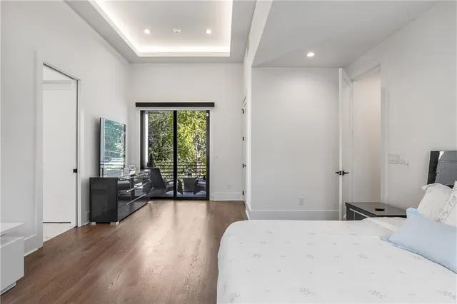 a bedroom with a large bed and a large window