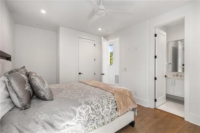 a bathroom with a bathtub shower sink and mirror