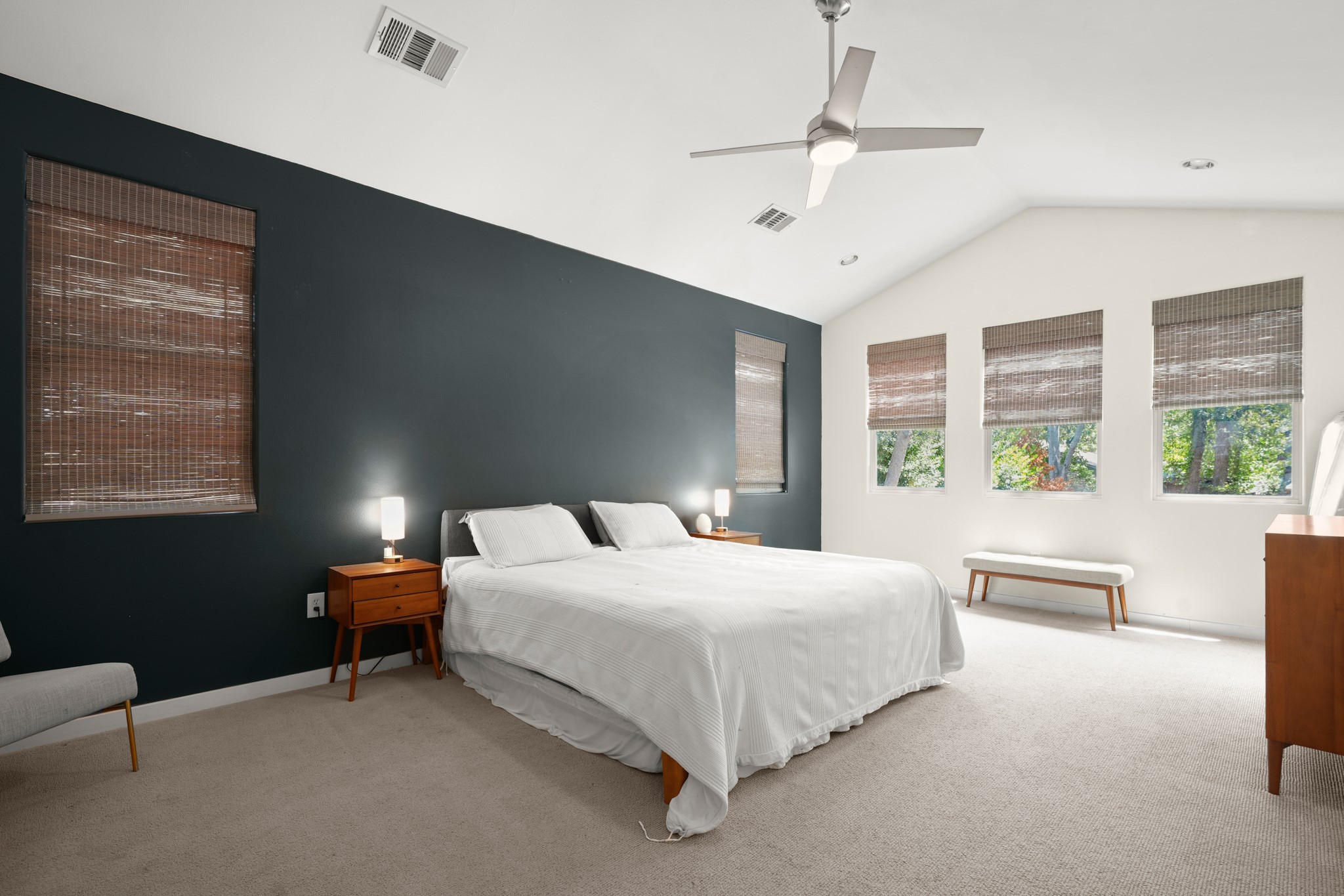 2501 Del Curto Road Austin, TX 78704 - Photo 16 of 26 Vaulted ceilings and generous windows define this peaceful bedroom retreat.