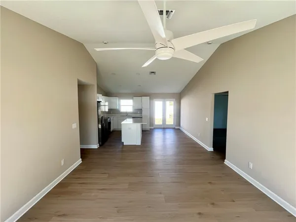 a view of a hallway with a living room